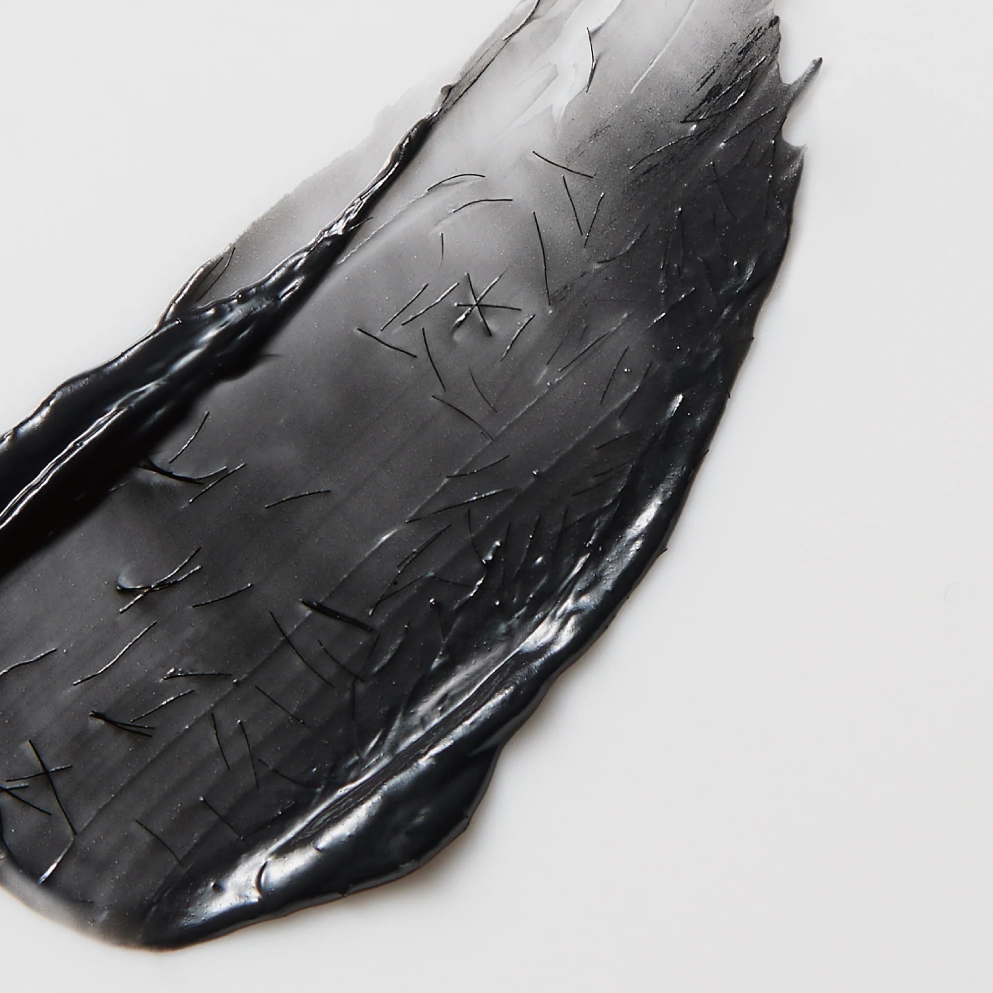 Black shoe insole with a brand logo on a white background