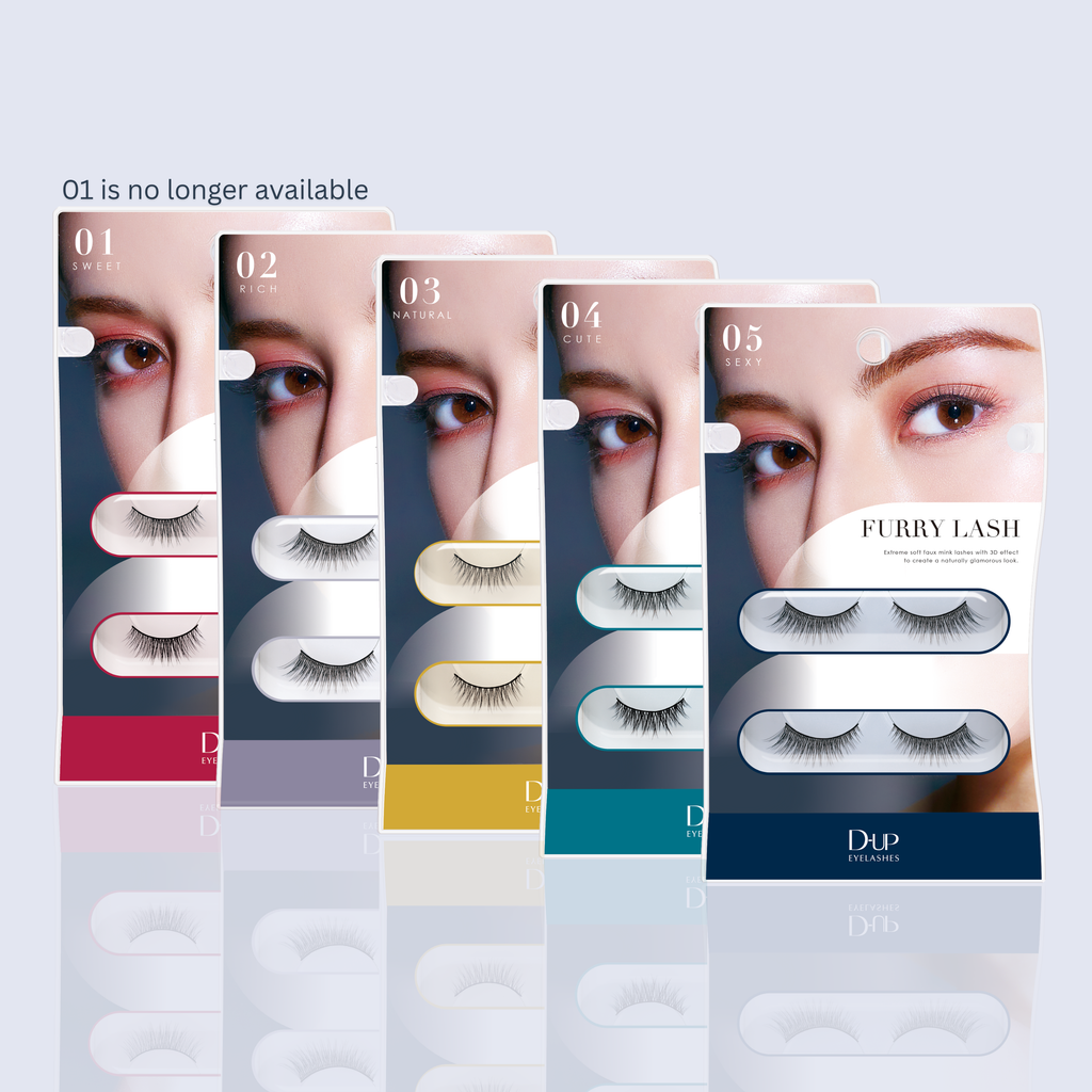 Set of false eyelash packages with visible brand name on a light gray background