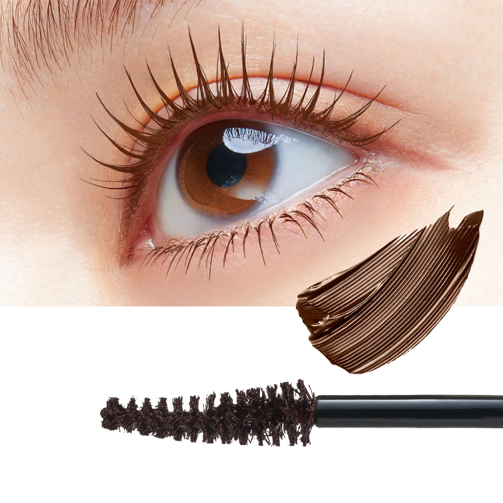 Close-up of a human eye with long, dark brown mascaraed eyelashes, alongside a swatch of the dark brown cosmetic product and the mascara wand on a white background.