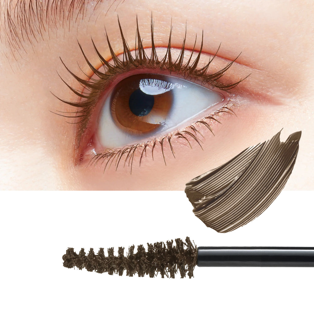 Close-up of a human eye with long, dark brown mascaraed lashes, plus a separate mascara wand and a swatch of the dark brown product on a white background.