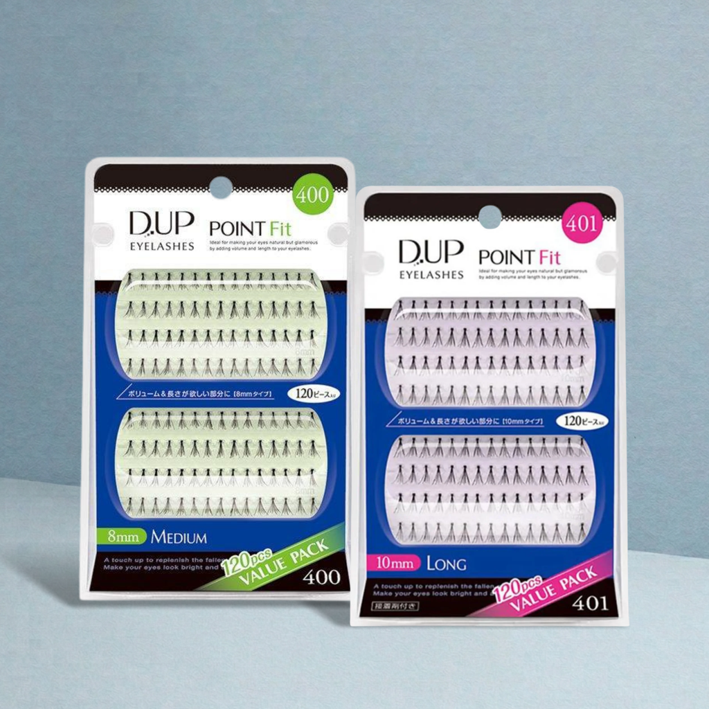 Two packages of DUP Eyelashes Point Fit false eyelashes displayed on a light blue-gray background. The left package is labeled 400 in green and shows medium-length lashes, while the right package is labeled 401 in pink and shows long lashes.