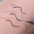 Three eyebrow pencil strokes on a pink background labeled 'Black', 'Gray Cashmere', and 'Natural Brown'.